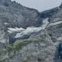 A looming rock collapse threatens a Swiss village as thawing permafrost destabilizes the Alps