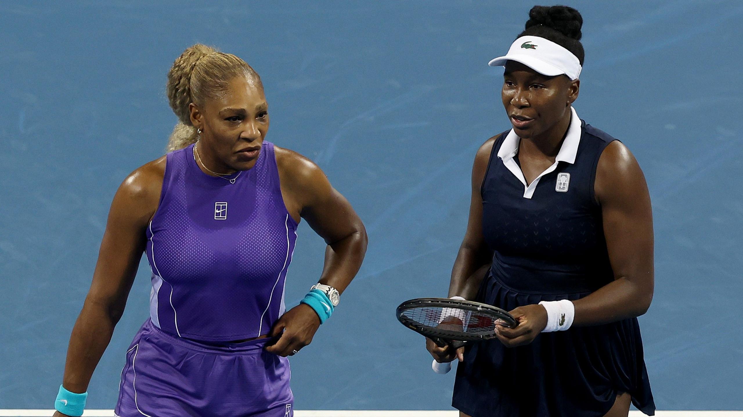 Williams sisters lose on doubles return