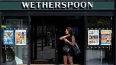 Wetherspoons bans customers playing music from phones in pubs