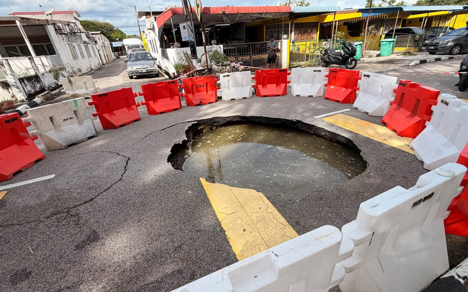 Large hole opens on road in Penang, forcing traffic closure