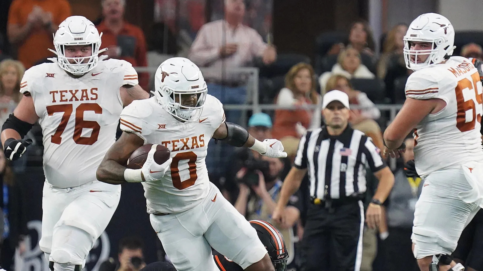Texas climbs to No. 11 as BYU falls after UCF upset