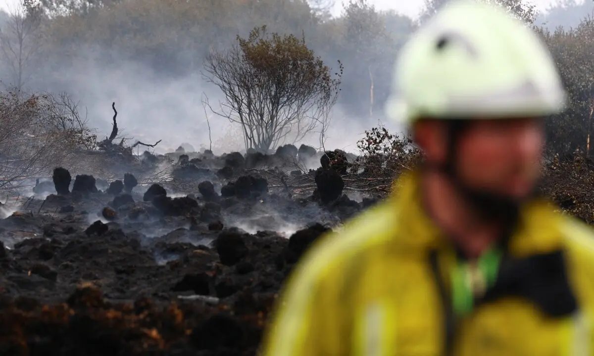Firefighters push to 'encircle' Belgian wildfire