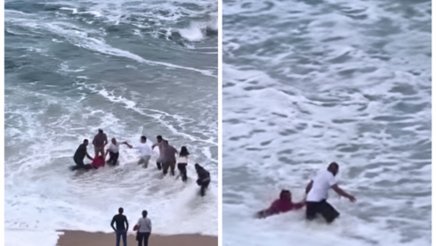 WATCH: Remarkable moment strangers form human chain to rescue woman swept out to sea on beach in northern Spain