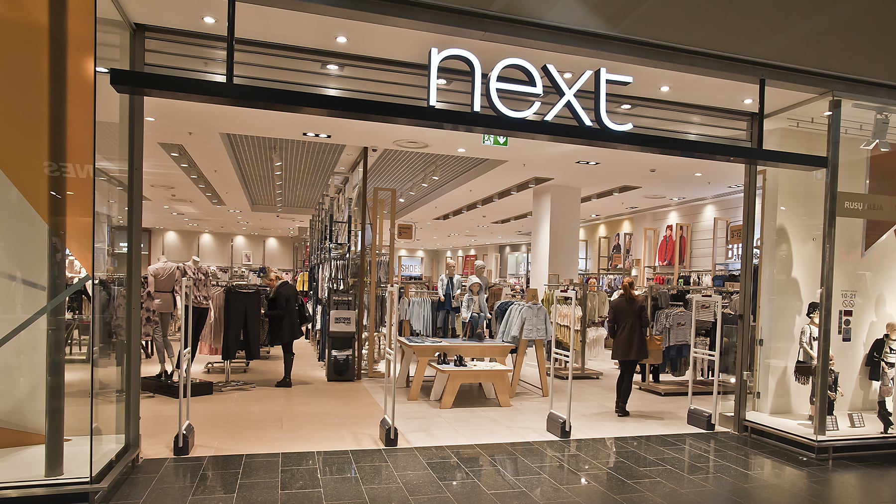 Next Upgrades Profit Outlook Again on Strong Summer Spending