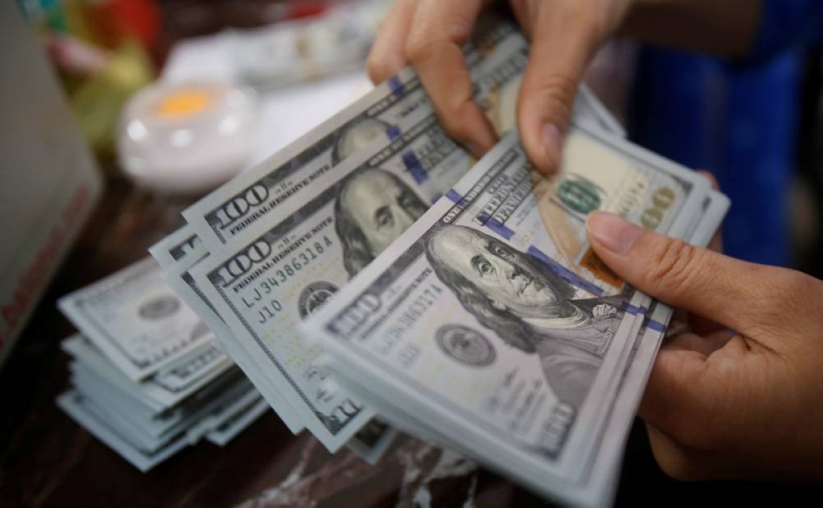 Dollar mostly flat as softer US data fuel dovish rate bets