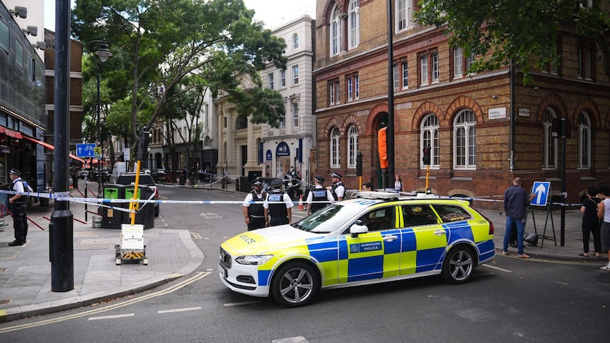 Woman arrested after four men stabbed in central London