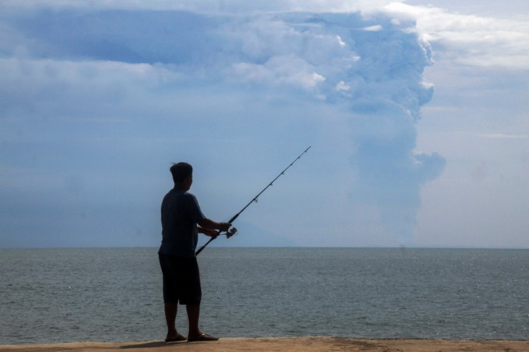 Mt. Anak Krakatau erupts more than two dozen times, blankets nearby island in as...