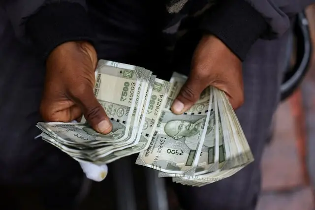Indian rupee to rise on dollar slump after Treasury boosts bond buyback; oil risk persists