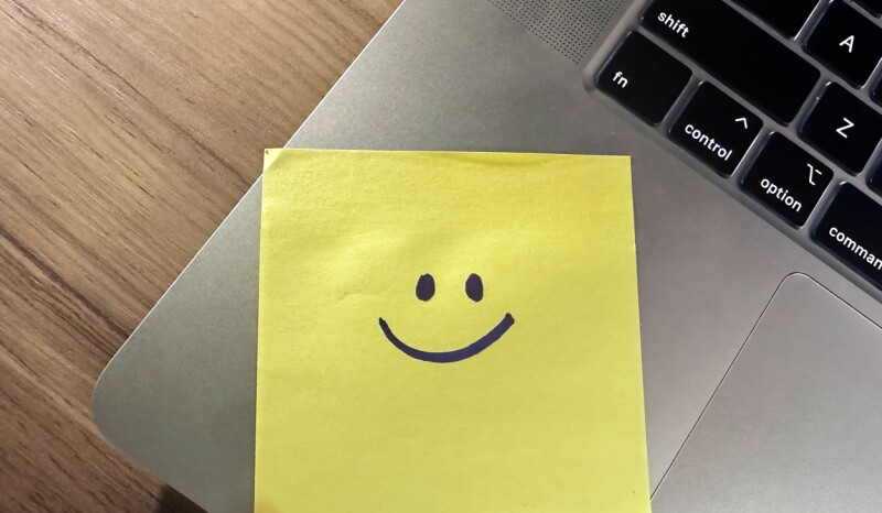 IT department put sticky notes on the laptops to help employees log in