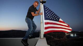 Ohio man arrived at his home in West Bank village of Qusra and raised an American flag