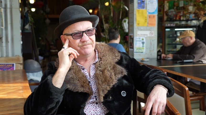 Cafe owner battles high sponsorship costs as government vows to cut migration