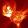 Stellar eruptions in the laboratory: First experimental evidence for their suppression in strong magnetic fields