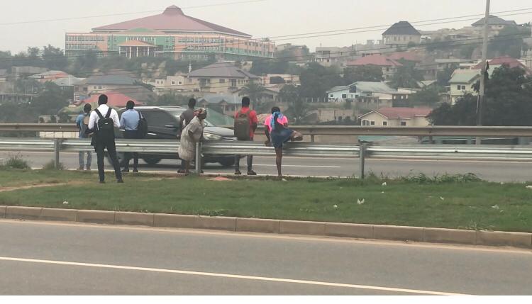 Pokuase residents raise safety concerns over dangerous roadside boarding point