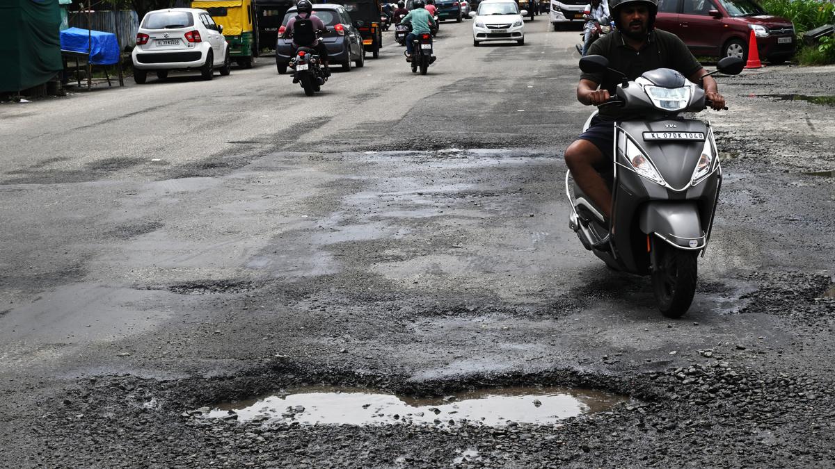 Monsoon lays bare Kochi’s battered roads as commuters bear the brunt