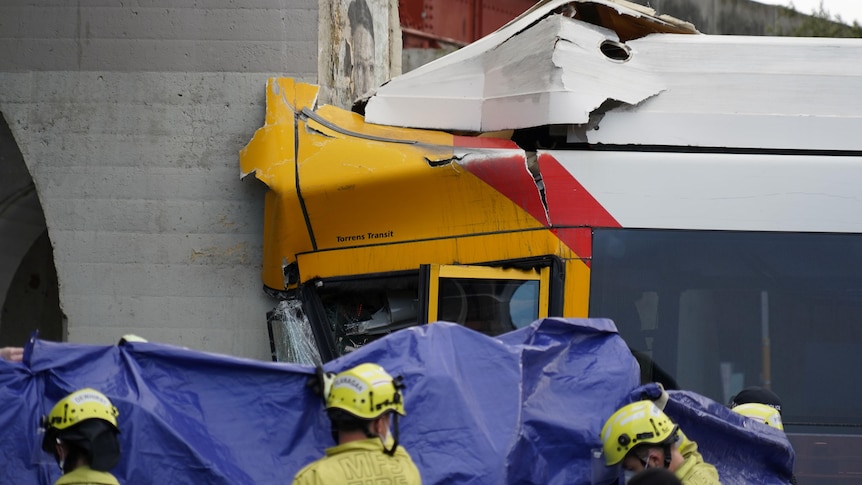 Driver, passenger trapped as bus crashes into train bridge