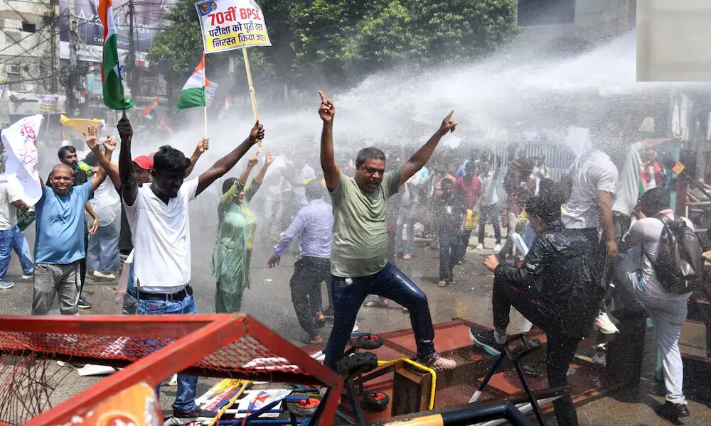 Indian police use water cannon at new protest over test paper leaks