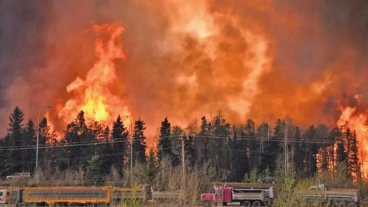 Over 20,000 evacuated as wildfire spreads in western Canada