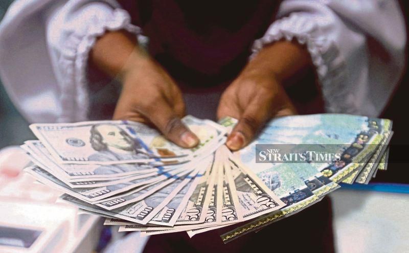 Ringgit opens higher against US dollar as US treasury yields ease