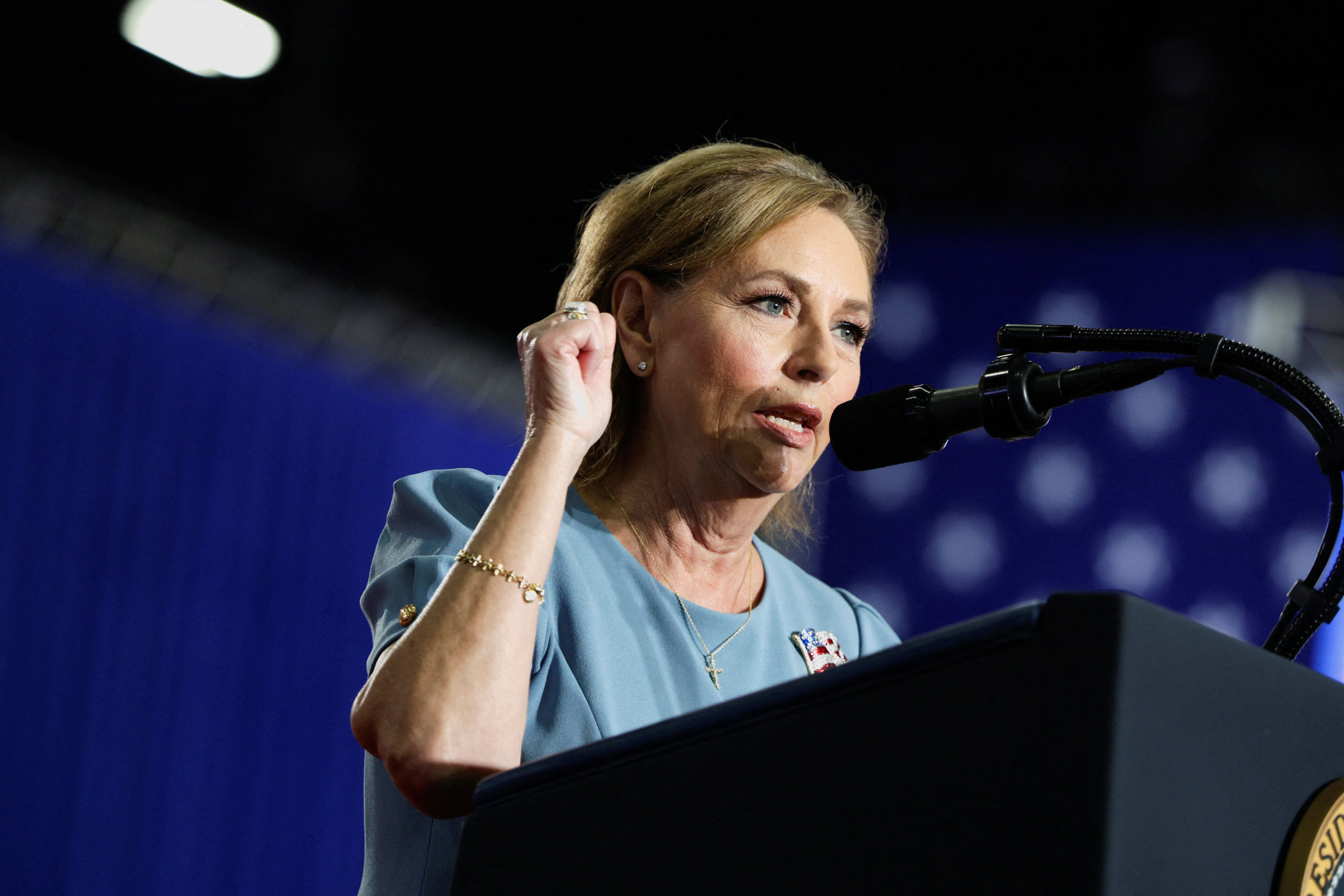 Graham keeps her Senate seat, vindicating Trump