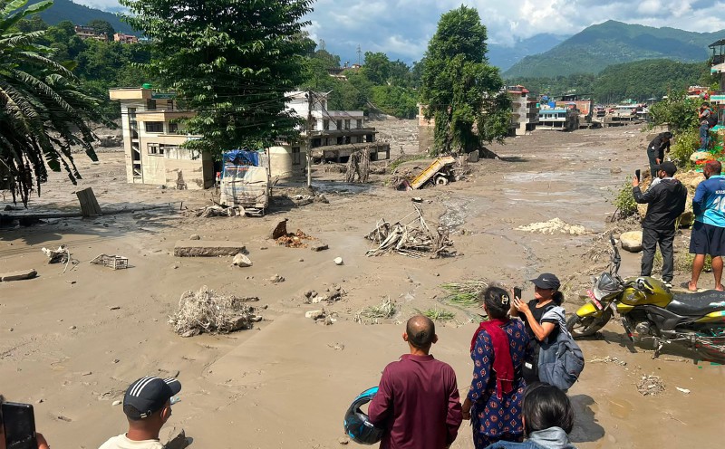 Nepal flash flood kills eight; damages roads, power projects