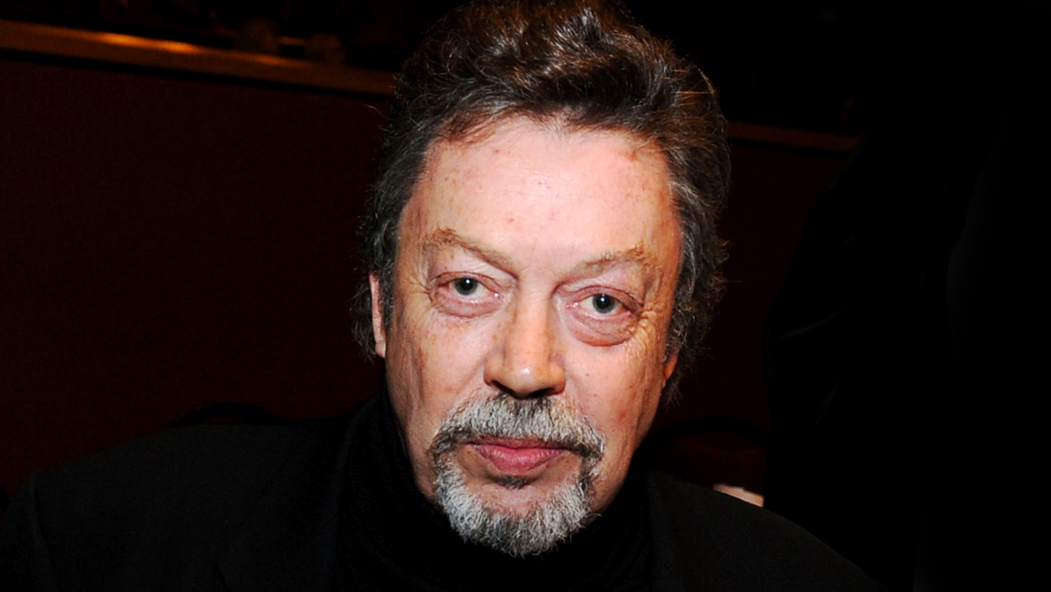 Luke Evans, ‘Clue’ Stars, Carol Burnett, Josh Gad & More Pay Tribute To Tim Curry