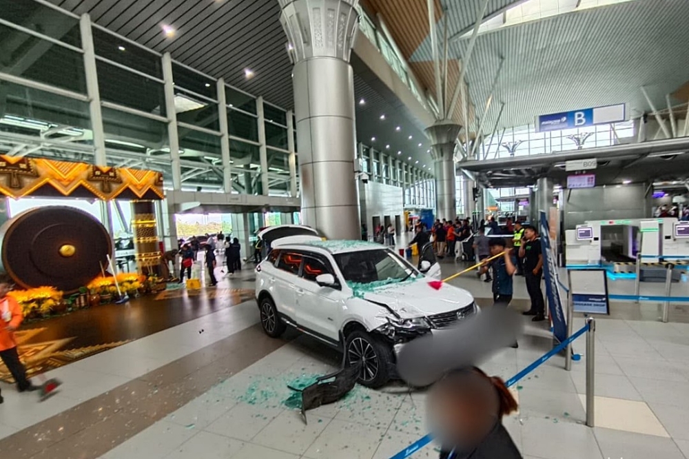 Driver forgot to put SUV in park before crashing into KKIA departure hall, police say