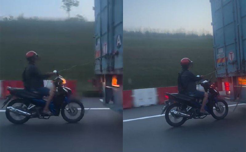 #NSTviral: Motorcyclist filmed being towed behind moving truck