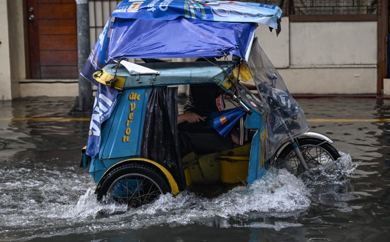 Philippine local malls shelter flood-affected residents in capital