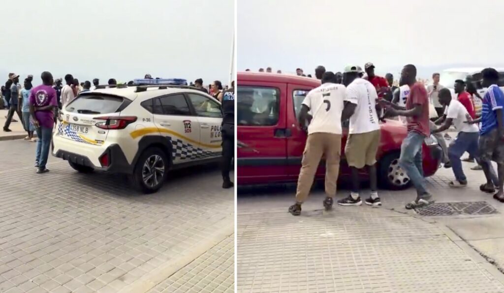 Looky Looky riot: Police surrounded as dozens of illegal street sellers try to stop arrest on Mallorca beach