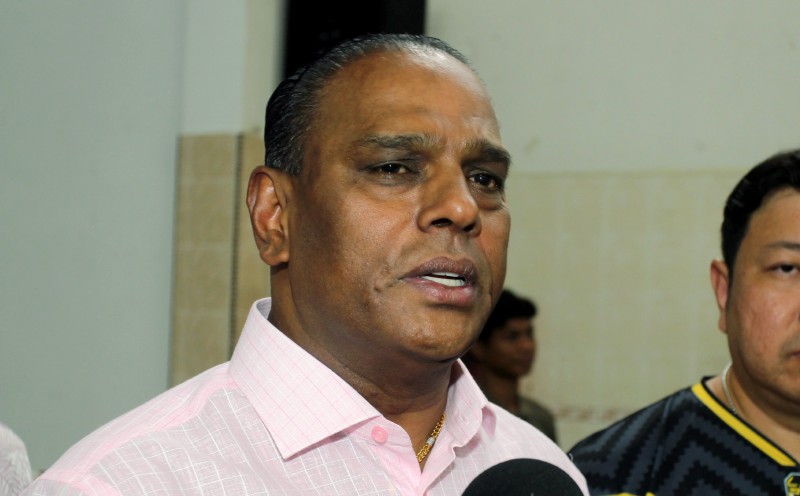 Black-clad supporters gather as Saravanan expected to face corruption charges