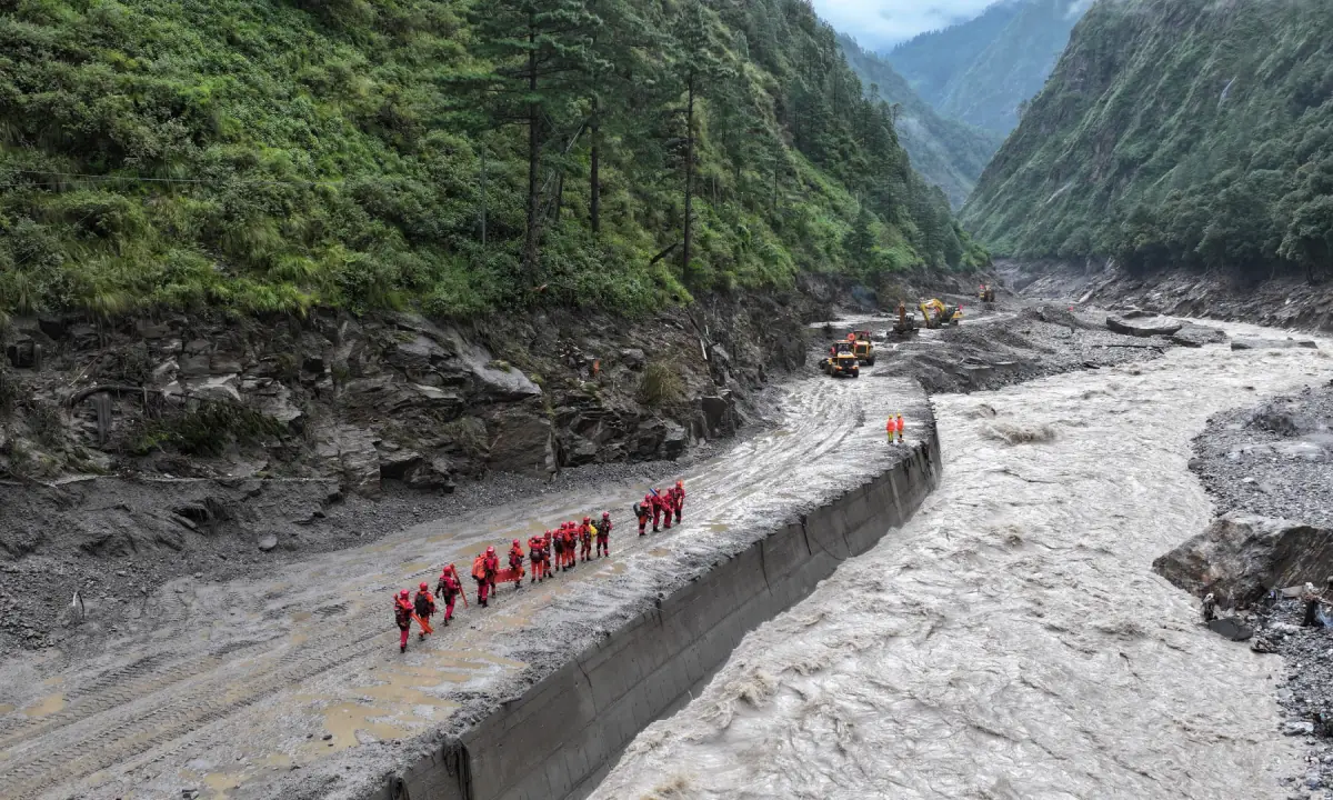 Two days on, rescuers scour debris in Nepal as risk of fresh flooding grows