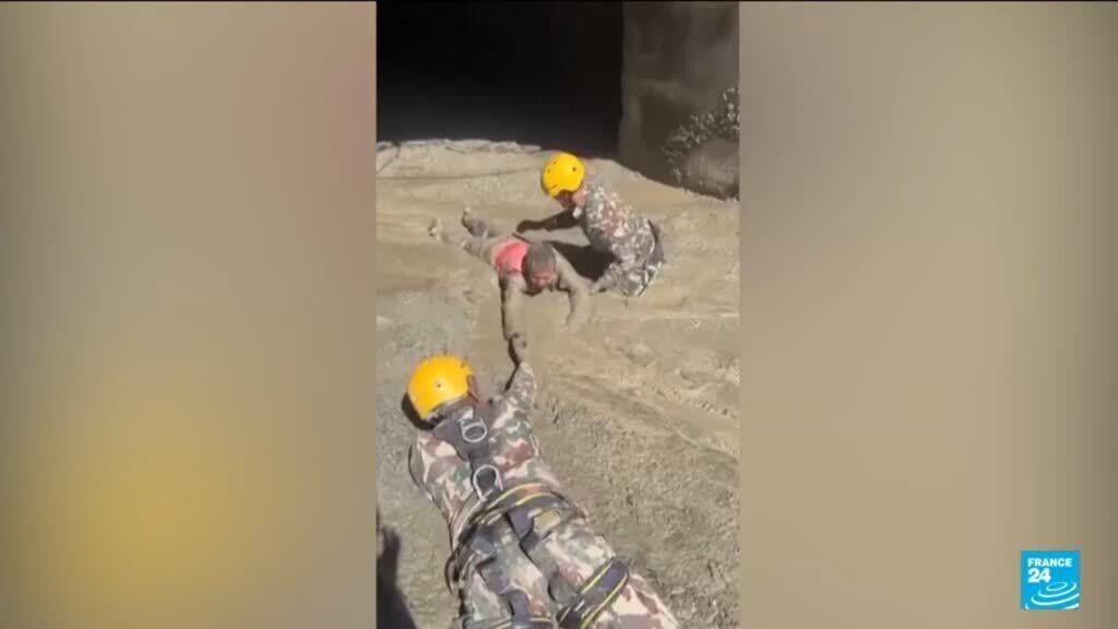 Nepal army races to rescue more than 100 trapped in hydropower tunnel after floods