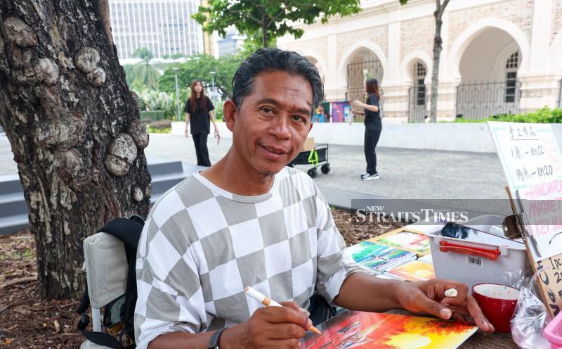Street artist keeps old KL alive through Merdeka memories