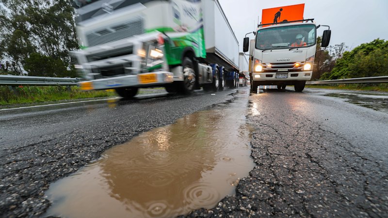 Potholes strand drivers as wild weather lashes Victoria