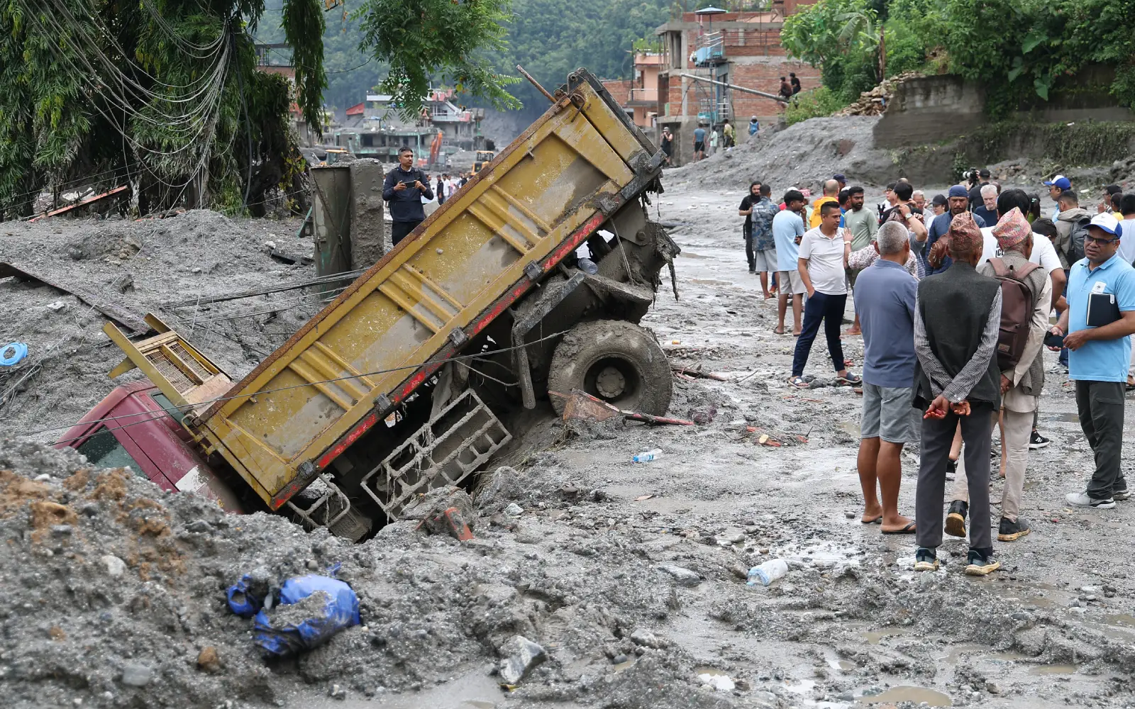Chinese rescuers zero in on Tibet mudslide site as lake threat eases