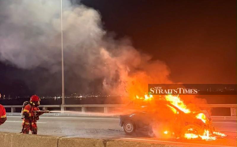 Woman escapes unhurt after car catches fire on Penang Bridge