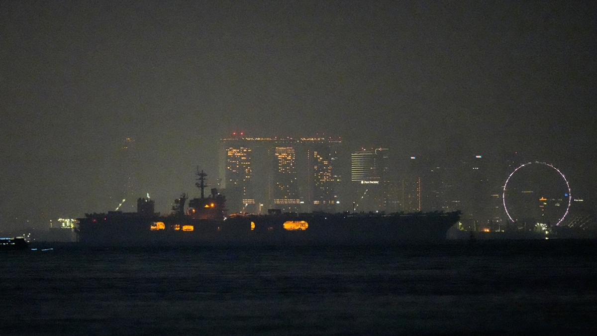 USS Abraham Lincoln sails past Singapore on its way home from Middle East