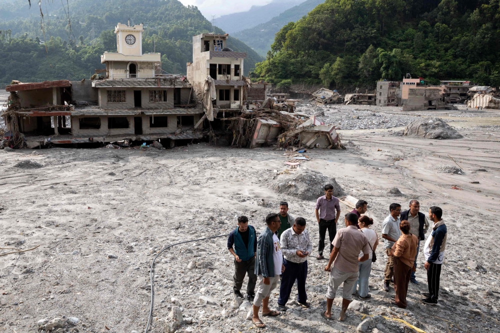 Rescuers dig into tunnel as missing toll from Nepal, China flood tops 3,000