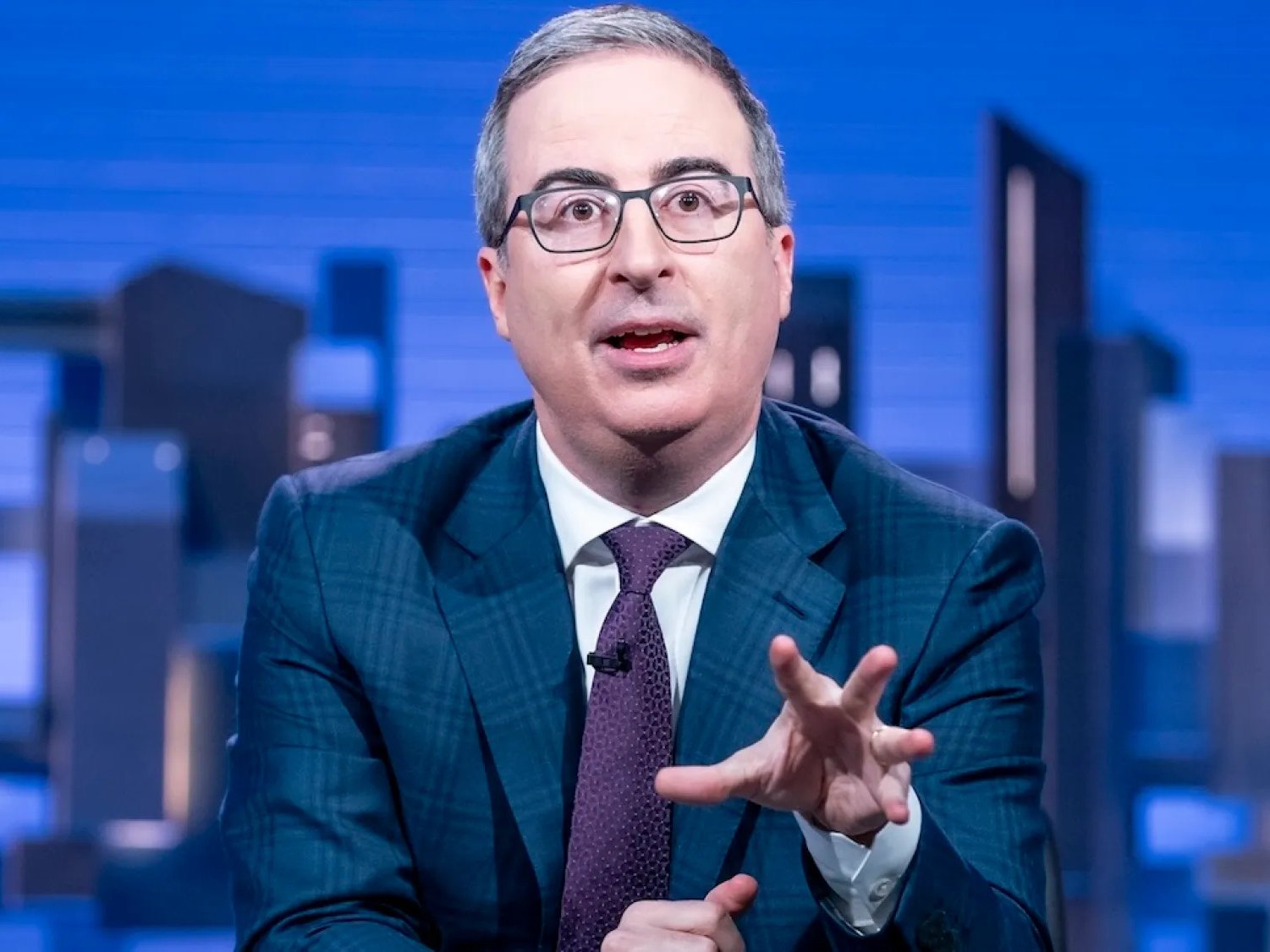 John Oliver Takes Shots at Own Company’s DC Superhero Movies on ‘Last Week Tonight’