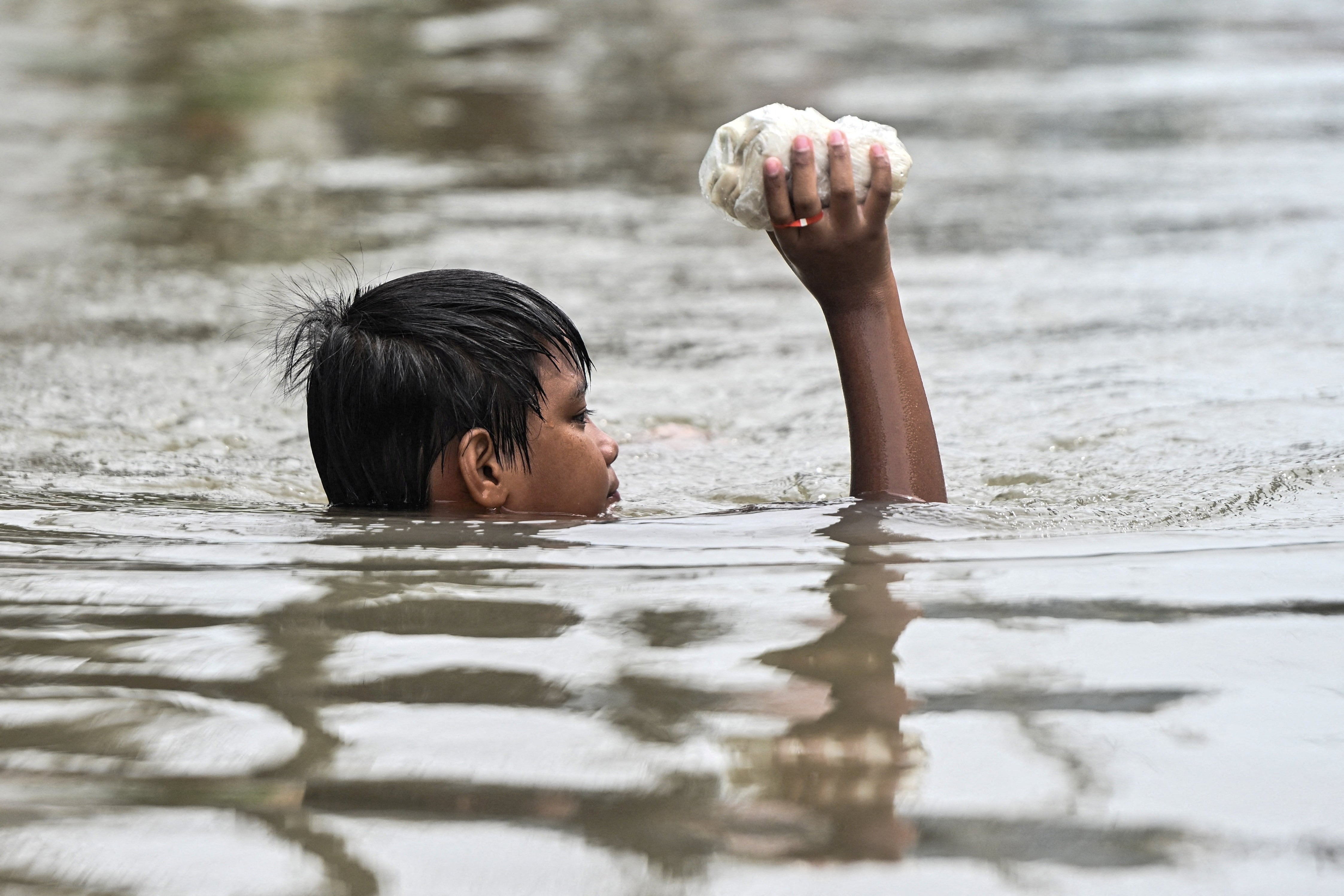 Philippines floods and landslides leave at least 12 dead