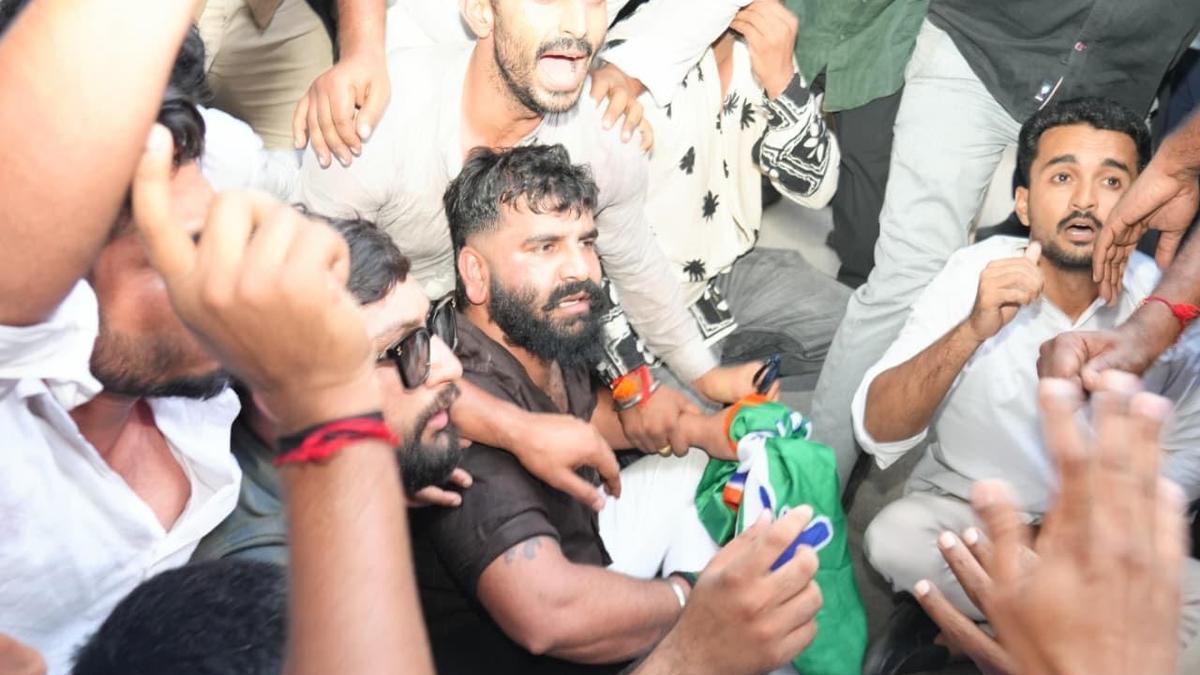 High drama unfolds as youth congress workers protest outside BJP office demanding Shah’s resignation