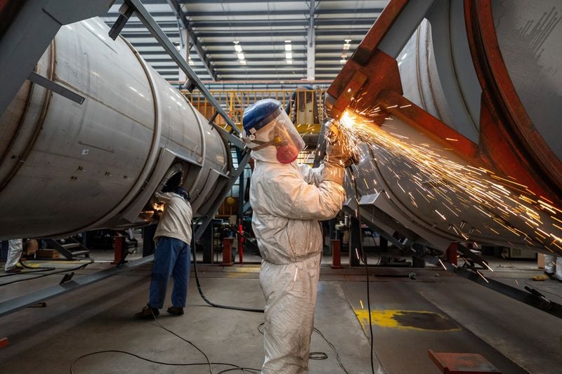 China’s factory activity improves but stays in contraction in August