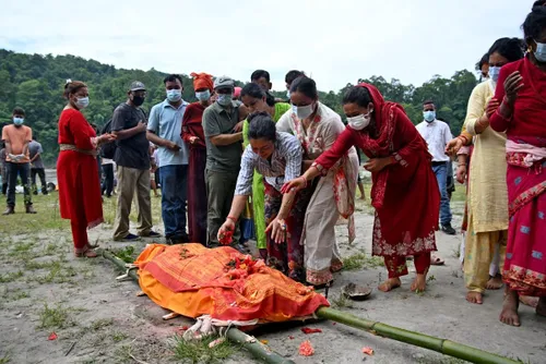 Mass burials begin in Nepal as flood disaster leaves thousands missing