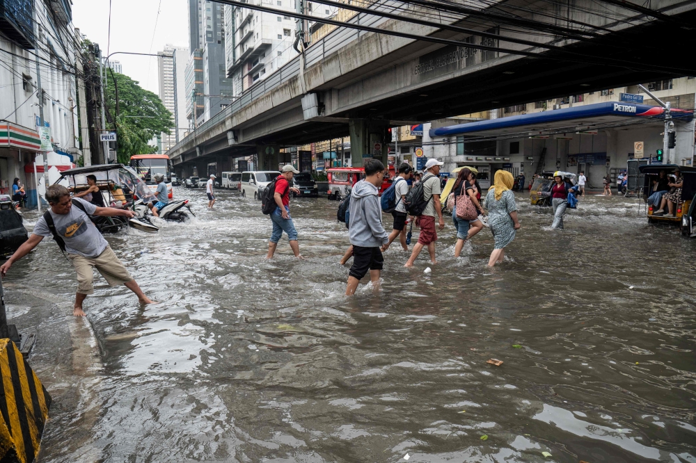 Days of heavy rain leave at least 13 dead in Philippines