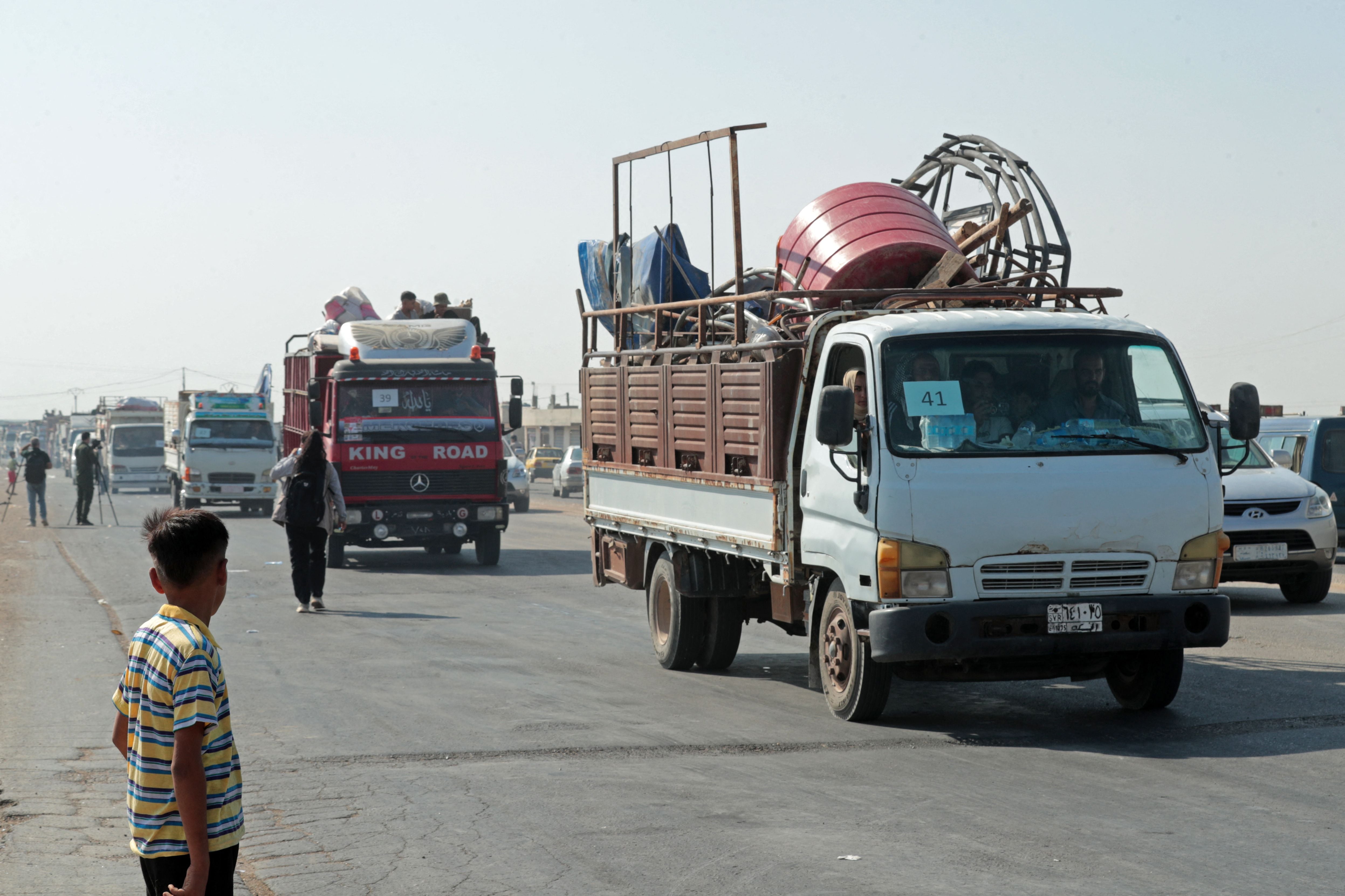 Violence mars return of displaced Syrian Kurds to border town after nearly seven years