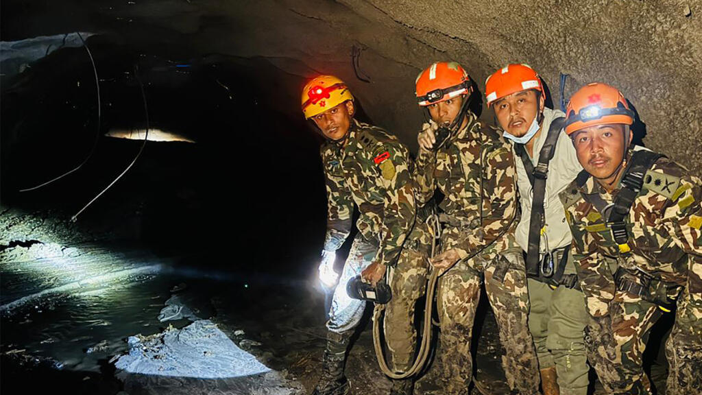 Nepal's rescuers navigate mud-swamped tunnels for hundreds of missing workers