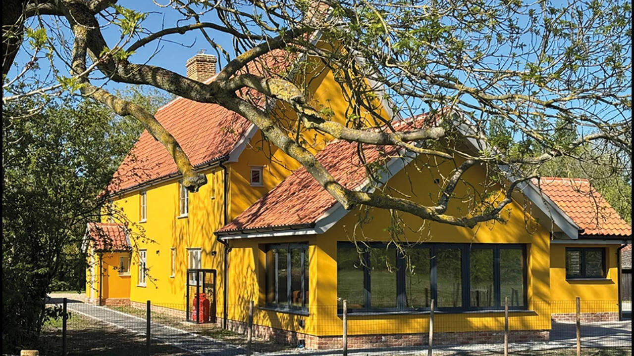 Builder restores 16th-century English longhouse and turns it into family home