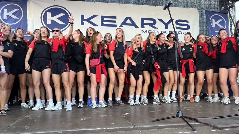 Thousands welcome home Cork camogie champions