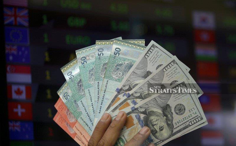 Ringgit opens lower vs greenback amid higher oil prices, Fed rate hike bets