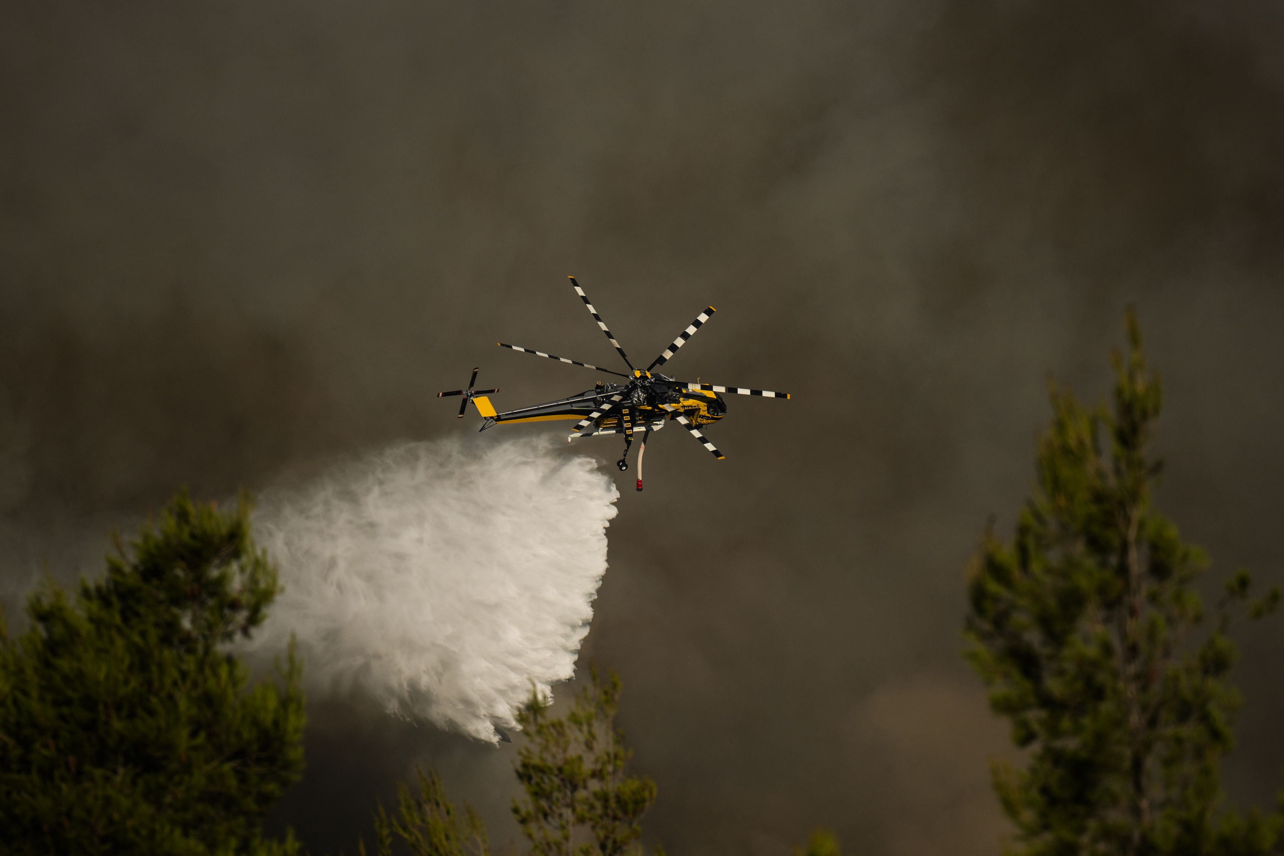 Two crew members killed as helicopters collide while fighting fires near Athens